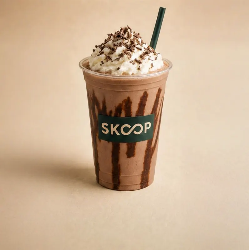 SKOOP chocolate milkshake cup, whipped cream and shavings